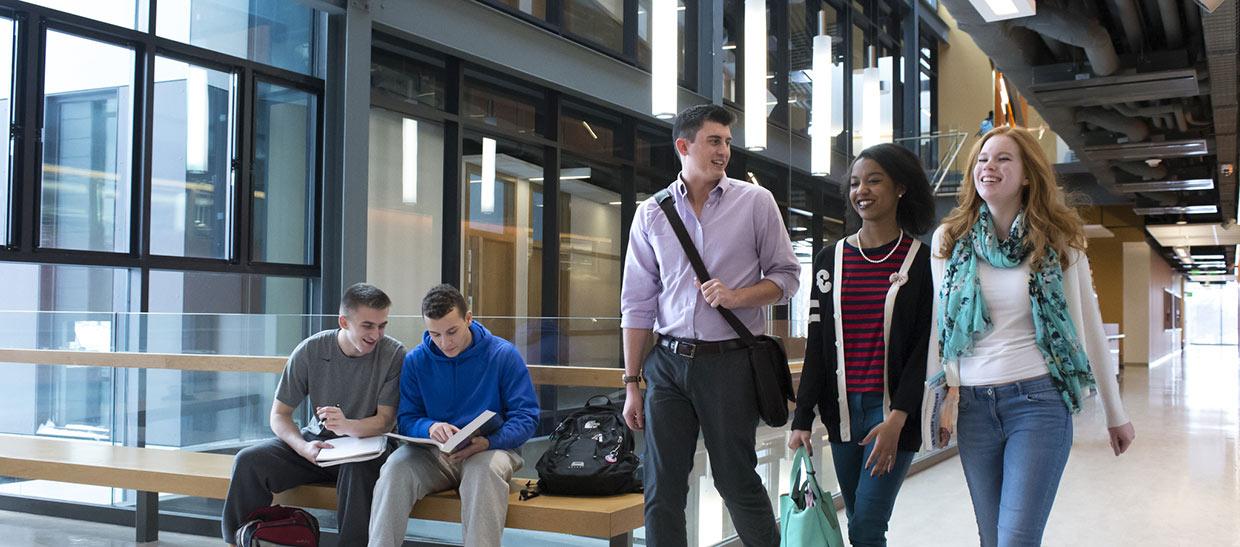 Students walking in a building on campus